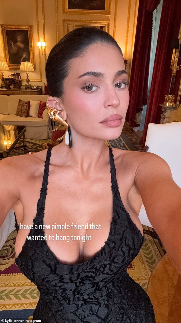 Allowing her dress to do the talking, Kylie slicked back her glossy raven tresses into a sleek bun, but accessorised with eye-catching gold jewellery