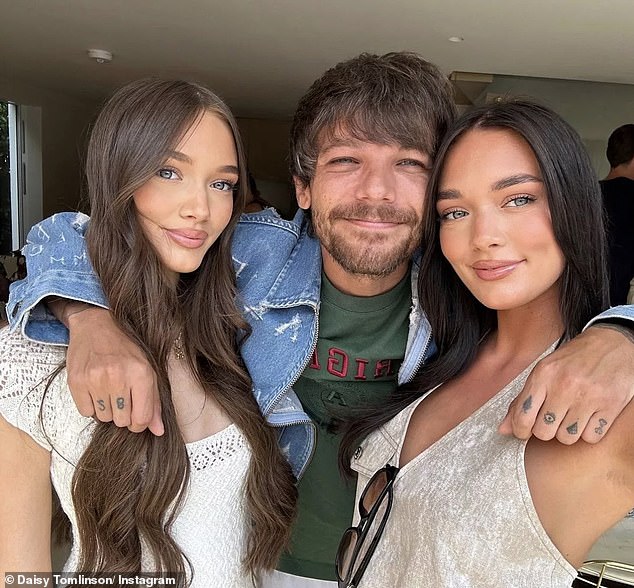 Louis pictured with his two sisters Phoebe and Daisy who have shown support for his new relationship with Zara