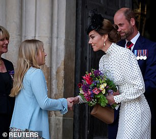 The Princess greeted two young girls with a handshake after the memorial service on Thursday
