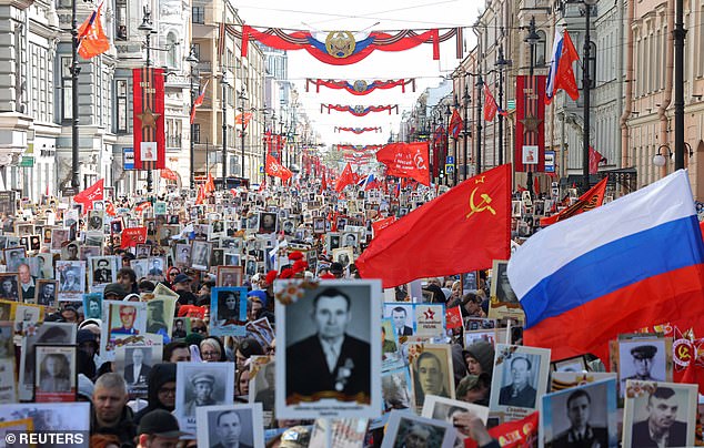 Russians flooded on to the streets of St Petersburg on May 9, carrying portraits of people including Red Army soldiers, to celebrate their victory over Nazi Germany in World War 2