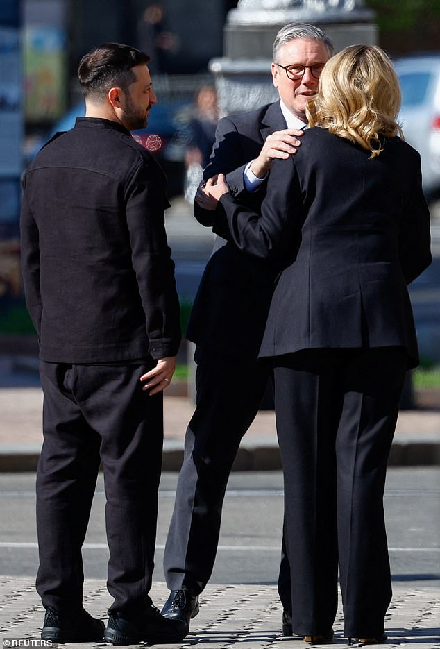 Starmer greets Ukrainian President Zelensky and his wife Olena at Independence Square in Kyiv