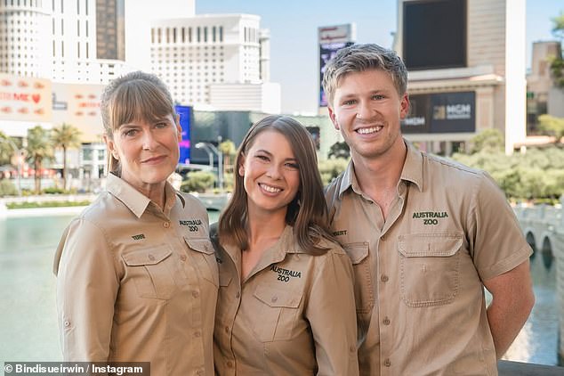 The conservationist, 26, suffered a ruptured appendix and was raced into surgery on Saturday, missing the prestigious event, which she was due to attend alongside brother Robert Irwin and mother Terri Irwin. The trio are pictured after arriving in Las Vegas this weekend