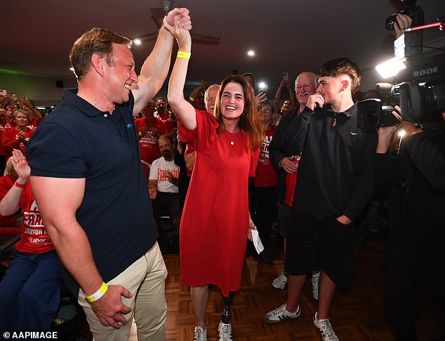 Ms France (centre) celebrated her victory on election night with her youngest son Zac and father