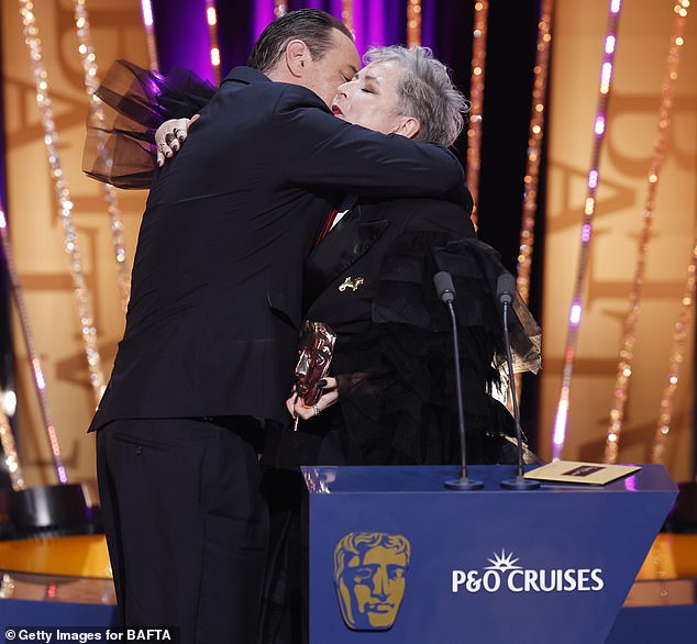 The actor embraced Siobhan McSweeney as he accepted the award on Sunday evening