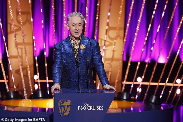 Returning to the stage as Dyer made his exit, ceremony host Alan Cumming told the audience: 'I've been asked to apologise for the naughty language there'