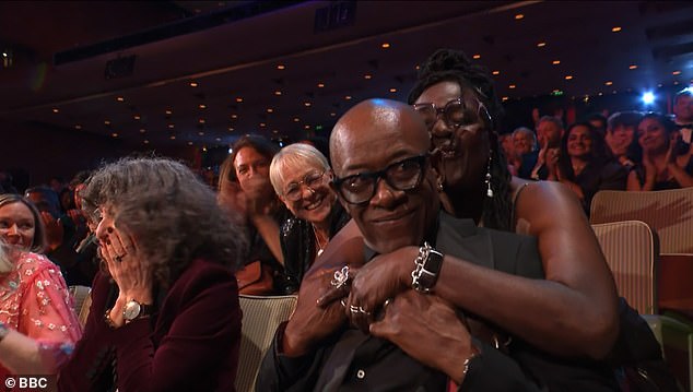 James was congratulated before making his way to the stage to collect his award at London's Royal Festival Hall