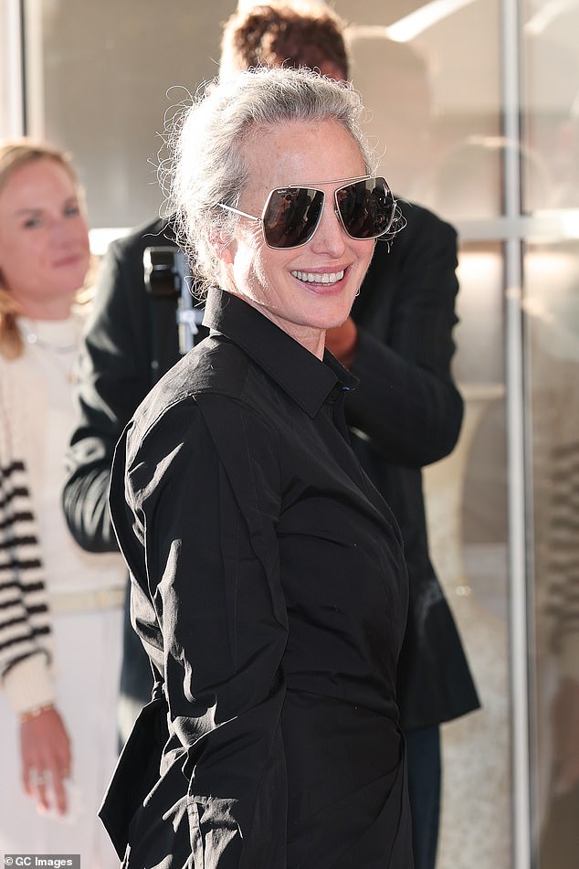 To accessorise, Andie kept a low profile in black-tinted aviator sunglasses as she slicked her light tresses into a slick bun