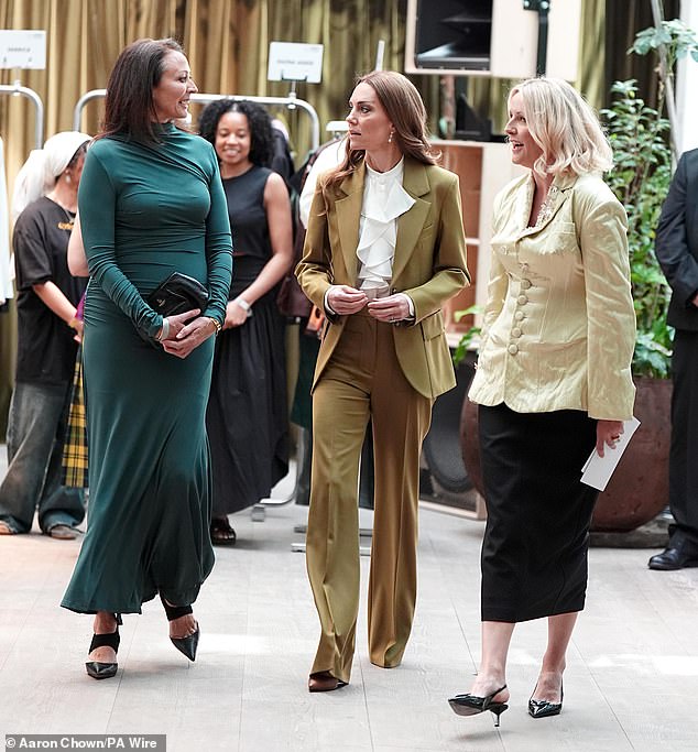 Paying homage to yet another fashionista, Kate was typically sophisticated in a stunningly tailored khaki power suit from Victoria Beckham which perfectly accentuated her silhouette
