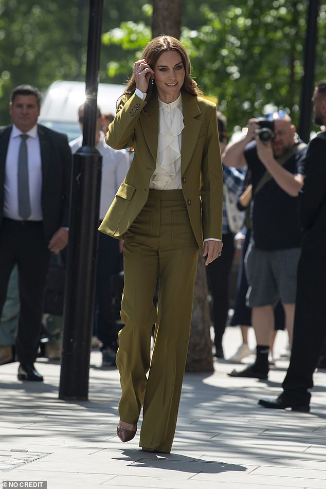 Kate, pictured, was effortlessly elegant in an olive power suit as she made an appearance at the event