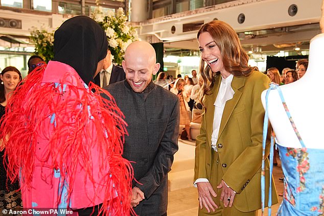 Kate was all smiles as she sported the khaki power suit by Victoria Beckham for the event this afternoon