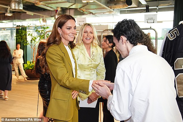 Kate met with designers, including Connor Ives (right) who told the Princess of their works this afternoon