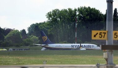 Operations at Belgium's second largest airport have been suspended due to a bomb alert on a Ryanair plane today. Pictured: The Ryanair airplane on the ground following the alert
