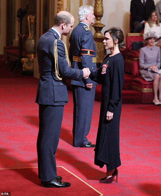 Victoria Beckham pictured receiving her OBE from William - then the Duke of Cambridge during an investiture ceremony at Buckingham Palace