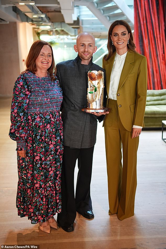 The Princess of Wales presenting Queen Elizabeth II Award for British Design to designer Patrick McDowell (centre) accompanied by his mother (left)