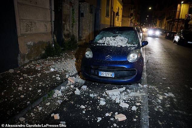 It triggered a seismic swarm which saw a series of less powerful tremors shake the city for two more hours as panicked residents huddled in the street