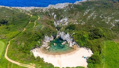 Although Playa de Gulpiyuri might be small in stature, it's not short on beauty. Backed by cliffs with golden sand, the beach is a popular spot with locals