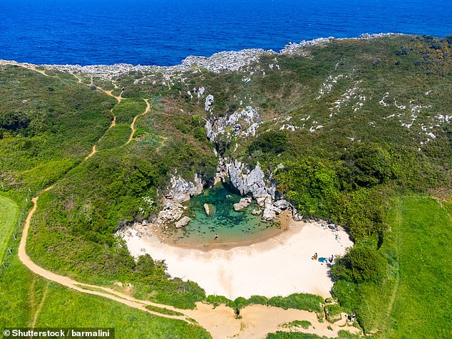 Although Playa de Gulpiyuri might be small in stature, it's not short on beauty. Backed by cliffs with golden sand, the beach is a popular spot with locals