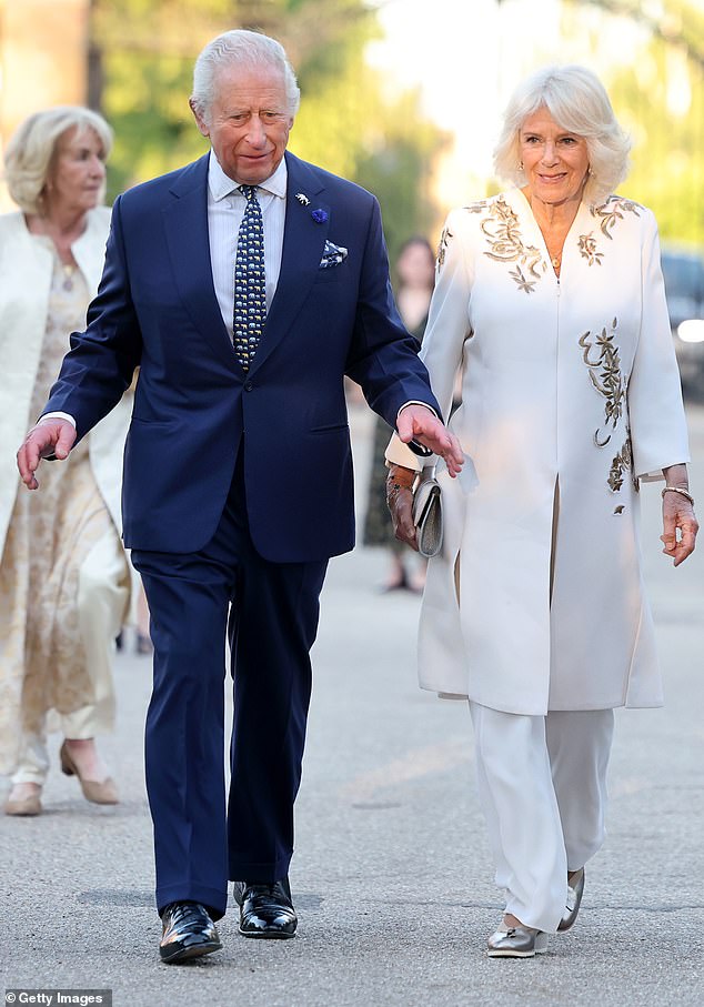 King Charles and Queen Camilla are pictured attending the Elephant Family Evening of Art and Conservation at Kew Gardens on Tuesday evening