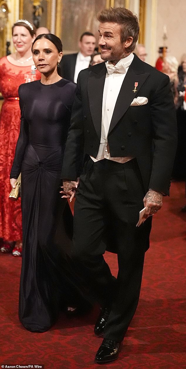 Recent reports suggest Victoria and David Beckham (pictured at Buckingham Palace last year) have become estranged from their eldest son, Brooklyn