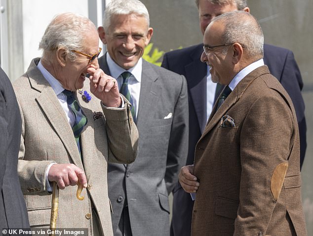 King Charles (pictured, left) is seen laughing while talking to Salman bin Hamad bin Isa Al Khalifa of Bahrain (pictured, right)
