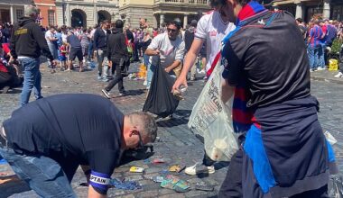 Crystal Palace fans were seen helping to clear up rubbish in central London