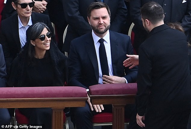 Zelensky (right) goes in for a handshake as he seeks Vice President J.D. Vance and First Lady Usha Vance at St. Peter's square in the Vatican City on Sunday, May 18, 2025