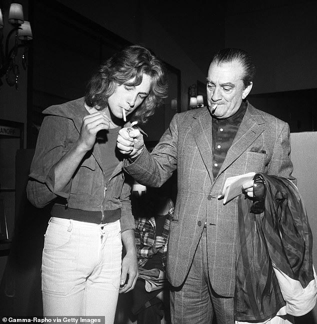 Director Luchino Visconti lighting Bjorn's cigarette at the Cannes Film Festival in 1971