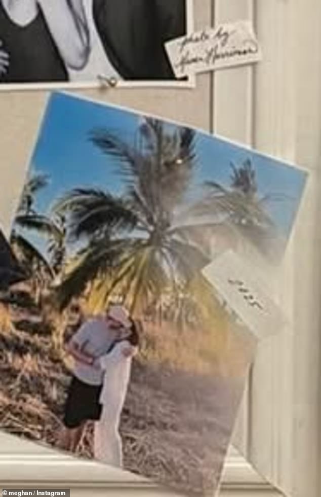 One of the most recent photos tacked on to the board is a sun-soaked snap of Harry and Meghan sharing a sweet kiss while posing in front of palm trees during what appears to be the couple's most recent getaway to Mexico with their children