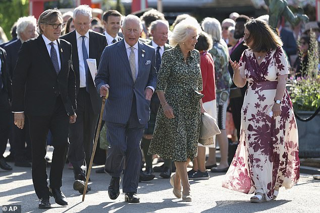 King Charles III, patron of the Royal Horticultural Society, center left, and Queen Camilla with Keith Weed, president of the RHS, left, and Clare Matterson, director general of the RHS, right