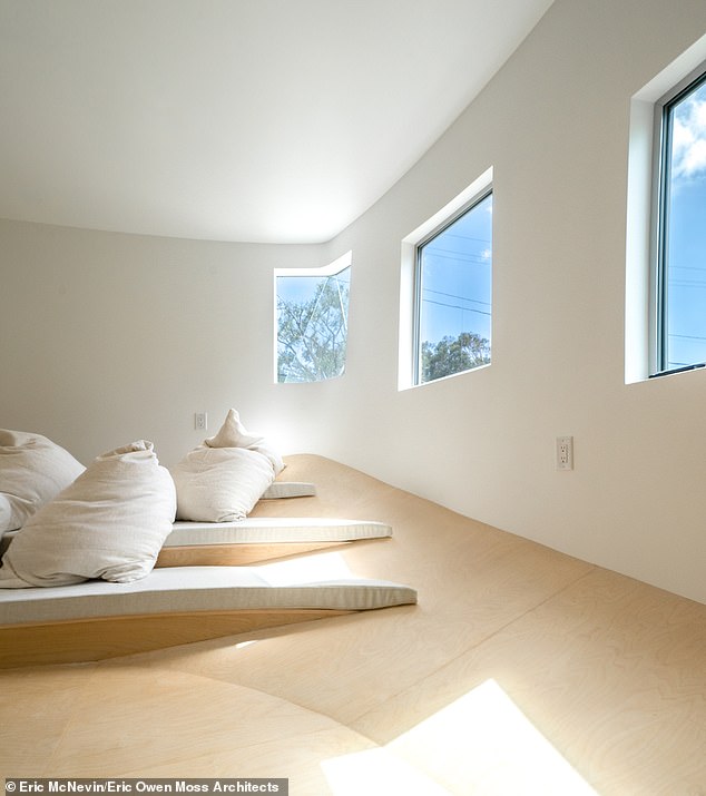 The second floor includes two bedrooms, each with their own seating areas and ensuite bathrooms