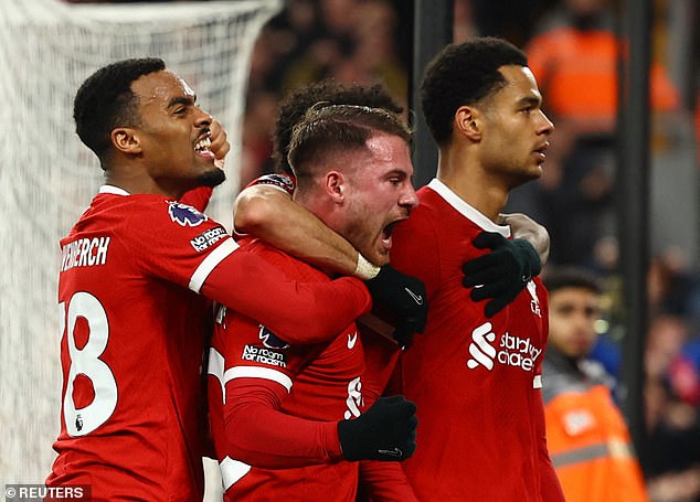 Neville included Ryan Gravenberch (left) after his stellar campaign at Anfield, but Carragher instead opted for the Dutchman's midfield team-mate, Alexis Mac Allister (centre)