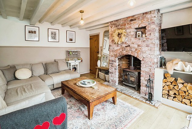 Wales, £400k: Features include a living room centred around a brick fireplace with log burner