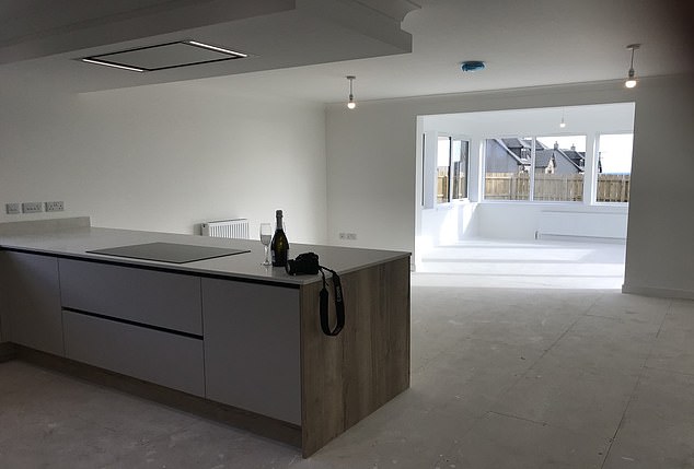 Scotland, £400k: It has an impressive open-plan luxury dining kitchen, family room