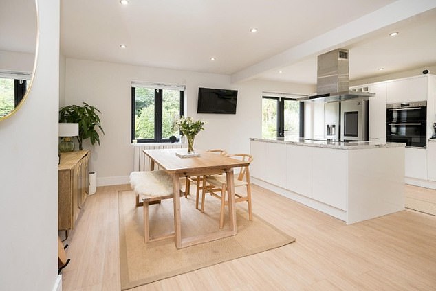 The spacious kitchen/dining area has plenty of space for entertaining and socialising