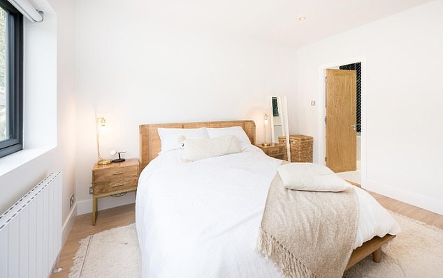 The master bedroom includes an en-suite bathroom and is tastefully decorated in neutrals