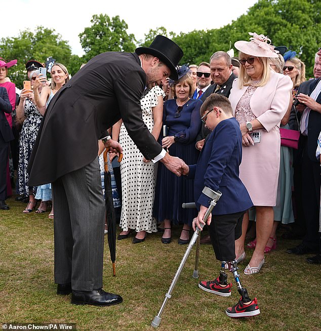 The Prince of Wales meets Tony Hudgell during a Royal Garden Party at Buckingham Palace, London