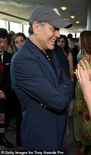 The 64-year-old first-time thespian has clearly been using temporary black hair dye to stain his signature gray locks in order to more authentically embody Edward R. Murrow in Good Night, And Good Luck