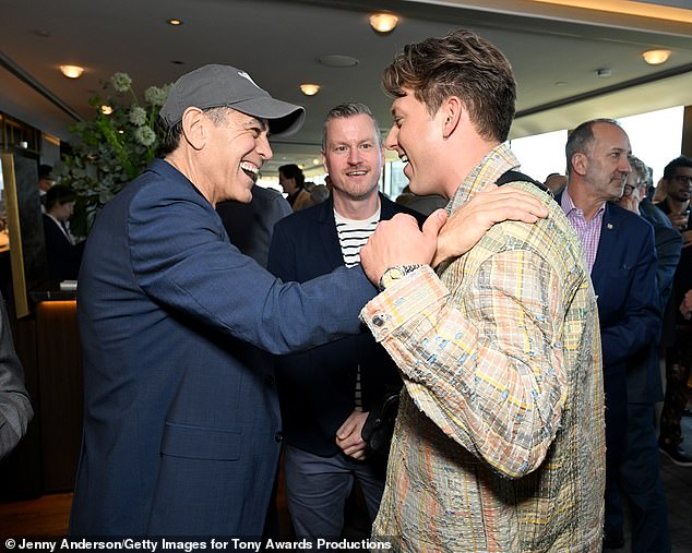 The two-time Oscar winner was all smiles while chatting with Sunset Boulevard star Tom Francis (R), who's nominated for best actor in a musical