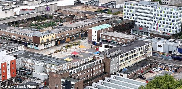 An aerial view of Harlow town centre, complete with boarded-up shops and few people milling about