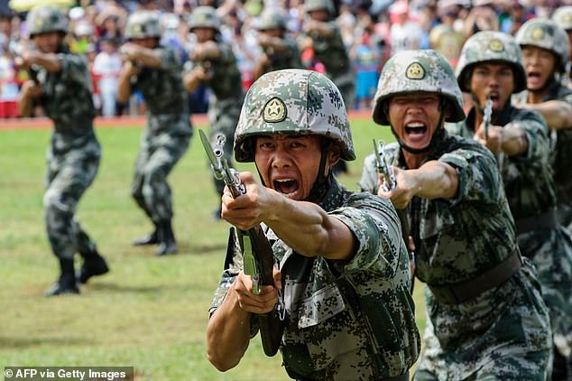 File photo. PLA soldiers shout during a demonstration in Hong Kong on July 1, 2016