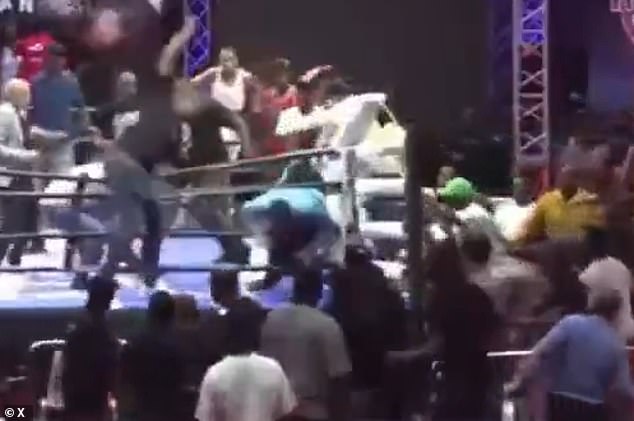Referee Smaylin Valdez fell between the ropes and crashed to the ground after he was swarmed and attacks by a group of fans following a bantamweight boxing match between Norbelto Jimenez and Marcelino Nieves in Santo Domingo, Dominican Republic on Saturday