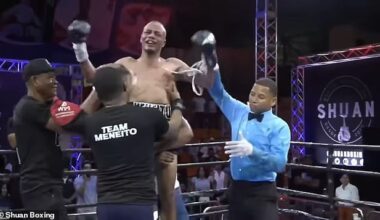 Referee Smaylin Valdez raises Norbelto Jiménez hand moments before fans surrounded and beat him inside the ring at the Juan Pablo Duarte Olympic Center in Santo Domingo, Dominican Republic on Saturday