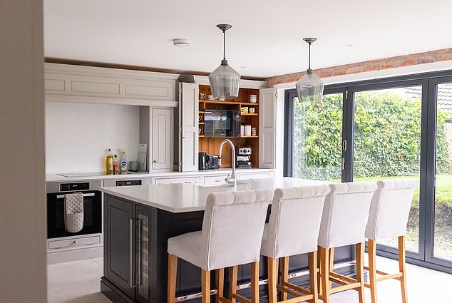 East Midlands, £400k: The kitchen has an island perfect for entertaining and family gatherings