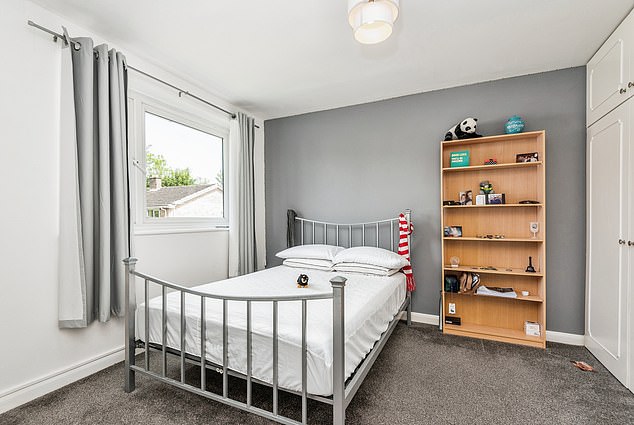 South West England, £400k: The property has a modern-looking grey carpet and curtains