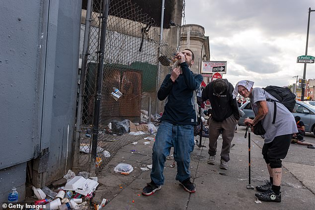 The researchers said the uptick was linked to surging overdose deaths from drugs among other factors. Pictured above are people suffering from drug dependency in Philadelphia, Pennsylvania