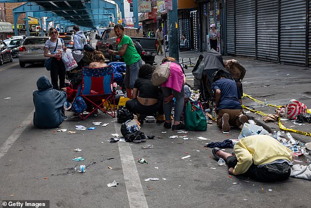 The above shows people suffering from drug dependency in Philadelphia, Pennsylvania. They were pictured on May 7