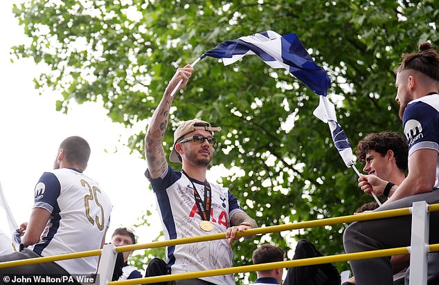 The squad celebrated on top of an open bus as they made their way through north London