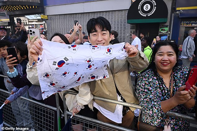 South Korean fans proudly waved their national flag at the parade on Friday evening in London