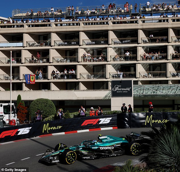Fernando Alonso steers his Aston Martin around Monaco's famous street track during practice