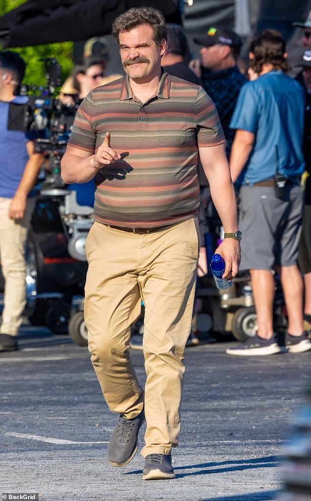 David Harbour looked a bit beefier on the set of his new show while shooting in Atlanta on Thursday, showing off more than a bit of tummy bulge beneath his golf shirt